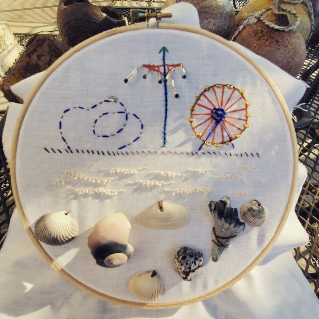 Embroidery in hoop inspired by Galveston beach and pier.